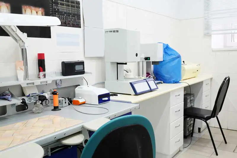 A long row of dental laboratory equipment at Columbia Implant Center 